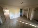 View of the bedroom with tile flooring, closet and attached bathroom at 13017 Club Dr, Hudson, FL 34667