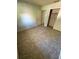 Simple bedroom with tile floors and closet at 13017 Club Dr, Hudson, FL 34667