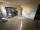 Bedroom with sliding glass doors providing access to the lanai and backyard at 13017 Club Dr, Hudson, FL 34667