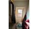 Indoor view of an exterior door leading outside, ready for renovation at 13017 Club Dr, Hudson, FL 34667