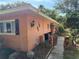 Charming home exterior featuring unique seahorse decorations and lovely landscaping at 13017 Club Dr, Hudson, FL 34667