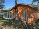 Exterior view of the home showing the siding and yard at 13017 Club Dr, Hudson, FL 34667