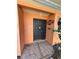 Inviting front door with decorative welcome sign and tiled entryway at 13017 Club Dr, Hudson, FL 34667