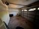 Spacious garage with overhead door, ready for renovation at 13017 Club Dr, Hudson, FL 34667