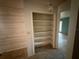 Hallway with closet and access to other rooms at 13017 Club Dr, Hudson, FL 34667