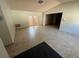 Bright and airy living room featuring tile floors, French doors, and neutral-toned walls at 13017 Club Dr, Hudson, FL 34667