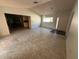Large living room with tile floors, chandelier and views of the dining area at 13017 Club Dr, Hudson, FL 34667