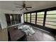 Bright sunroom with large windows, perfect for relaxing or entertaining, enhanced by natural light at 13017 Club Dr, Hudson, FL 34667