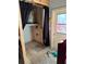 Utility room with water heater, plumbing and open ceiling at 13017 Club Dr, Hudson, FL 34667