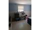 Bedroom with personal items and a queen air mattress at 14396 Pambar Ave, Port Charlotte, FL 33953