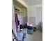 Inside closet, with clothes, boxes, and personal items at 14396 Pambar Ave, Port Charlotte, FL 33953