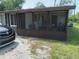 Enclosed porch area, with access to yard at 14396 Pambar Ave, Port Charlotte, FL 33953