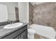 Bathroom showcases a white tub and shower combination with a granite countertop vanity at 15508 High Bell Pl, Bradenton, FL 34212