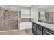 Beautiful primary bathroom featuring a glass shower and a soaking tub at 15508 High Bell Pl, Bradenton, FL 34212