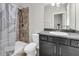 Bathroom showcases a tile shower with a granite countertop vanity at 15508 High Bell Pl, Bradenton, FL 34212