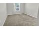 Sunlit bedroom featuring plush carpeting and a window at 15508 High Bell Pl, Bradenton, FL 34212