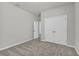 Neutral bedroom featuring plush carpeting and a double-door closet at 15508 High Bell Pl, Bradenton, FL 34212