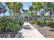 Elegant clubhouse exterior with lush landscaping and a welcoming entrance at 15508 High Bell Pl, Bradenton, FL 34212