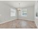 Bright dining area featuring tile floors, neutral walls, and large windows at 15508 High Bell Pl, Bradenton, FL 34212