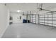 An expansive three car garage with ample space for vehicles and storage at 15508 High Bell Pl, Bradenton, FL 34212
