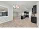 Bright eat-in kitchen with island, modern light fixtures, and black appliances at 15508 High Bell Pl, Bradenton, FL 34212