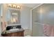 Bathroom features a black granite sink, toilet, and a frosted glass shower at 1838 Restful Dr # K-1, Bradenton, FL 34207