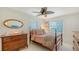 Cozy bedroom features natural light, ceiling fan, and classic wood furniture at 1838 Restful Dr # K-1, Bradenton, FL 34207