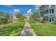 Beautifully landscaped courtyard with walking path and lush greenery at 1838 Restful Dr # K-1, Bradenton, FL 34207
