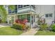 Charming entrance with colorful plants and a screened sunroom at 1838 Restful Dr # K-1, Bradenton, FL 34207