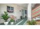 Inviting front porch with rocking chair, potted plants, and a view of the entrance at 1838 Restful Dr # K-1, Bradenton, FL 34207