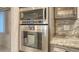 Close up of kitchen oven, microwave, countertops, and cabinets at 1838 Restful Dr # K-1, Bradenton, FL 34207