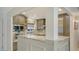Modern kitchen with stainless steel appliances, marble countertops, and a breakfast bar at 1838 Restful Dr # K-1, Bradenton, FL 34207