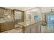 Bright kitchen featuring stainless steel appliances, marble countertops, and an open view to the living area at 1838 Restful Dr # K-1, Bradenton, FL 34207