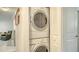 Convenient laundry area features a stacked washer and dryer in a closet at 1838 Restful Dr # K-1, Bradenton, FL 34207
