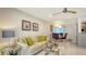 Open-concept living room with stylish decor, contemporary lighting, and elegant furniture at 1838 Restful Dr # K-1, Bradenton, FL 34207