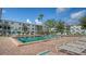 Community outdoor pool area with lounge chairs and pristine water at 1838 Restful Dr # K-1, Bradenton, FL 34207