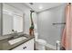 Modern bathroom features a floating vanity, a colorful giraffe figure, and neutral decor at 1919 Laurel St, Sarasota, FL 34236