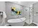 Elegant bathroom features a standalone tub and a glass-enclosed shower, creating a luxurious and tranquil retreat at 1919 Laurel St, Sarasota, FL 34236