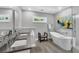 Modern bathroom featuring double sinks, a soaking tub, and a glass-enclosed shower, offering a spa-like experience at 1919 Laurel St, Sarasota, FL 34236