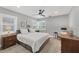 Cozy bedroom features natural light, a ceiling fan, and a calming gray color scheme for a relaxing atmosphere at 1919 Laurel St, Sarasota, FL 34236