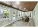 Dining room boasts wood ceiling, natural light, and a view of the lush backyard at 1919 Laurel St, Sarasota, FL 34236