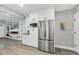 Bright kitchen with stainless steel appliances and white cabinets, seamlessly blending modern amenities with a sleek design at 1919 Laurel St, Sarasota, FL 34236