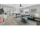 Open-concept space with sight lines to the kitchen, living room with a comfortable sofa, and natural light at 1919 Laurel St, Sarasota, FL 34236