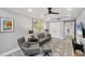 Modern living room featuring a sleek sofa, cozy armchair, and tasteful decor, creating a welcoming and relaxing atmosphere at 1919 Laurel St, Sarasota, FL 34236