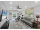 Contemporary living room with stylish furniture, sleek decor, and a large television, designed for comfort and entertainment at 1919 Laurel St, Sarasota, FL 34236