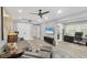 Spacious living room with modern furniture, including a comfortable seating area and adjacent office space at 1919 Laurel St, Sarasota, FL 34236