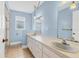 Bright bathroom features a dual sink vanity, hanging lights, and ample counter space at 2002 8Th W St, Palmetto, FL 34221
