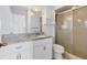 Bright bathroom with granite countertop, white cabinets, and walk-in shower at 2002 8Th W St, Palmetto, FL 34221