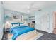 Comfortable bedroom with a bright blue comforter, stylish decorations, and an adjacent working space at 2002 8Th W St, Palmetto, FL 34221
