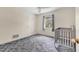 Cozy bedroom featuring ample space for a small , carpet, and a window for natural light at 2002 8Th W St, Palmetto, FL 34221